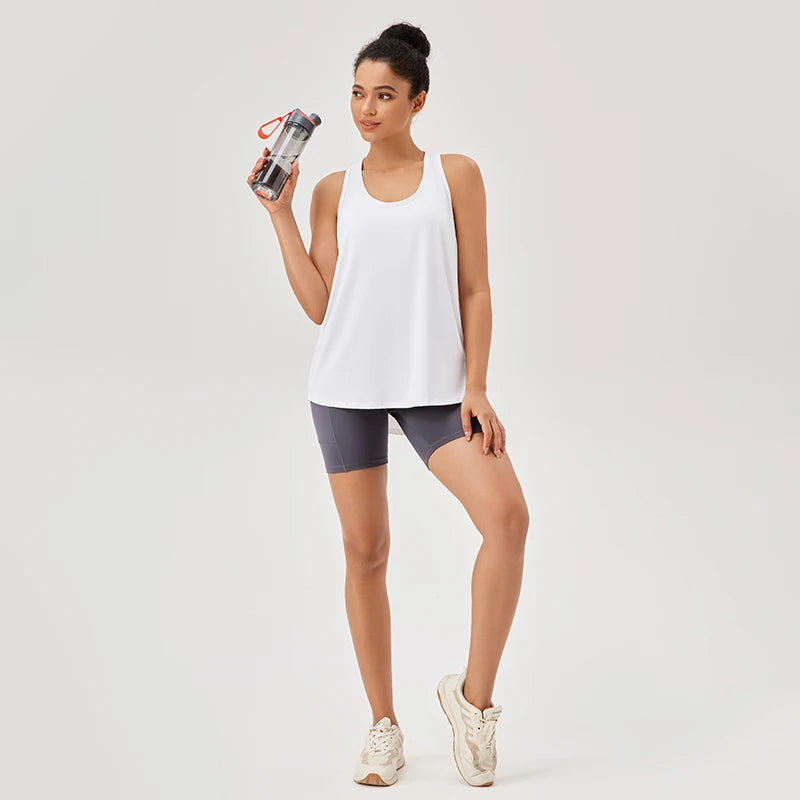 Regata Sem Costura, Regata Lupo, Regata Canelada, Regata de Malha, Regatinha em Malha, Regata de Academia, Regata Fitness, Regatinha Com Bojo, Camiseta de Academia, Camiseta Básica Feminina, Camiseta Fitness, Camiseta Esportiva, Camiseta de Ginástica, Roupa de Yoga, Moda Fitness, Roupa Para Academia, Roupa de Academia, Roupas Fitness Top Para Academia, Conjunto Para Academia.
